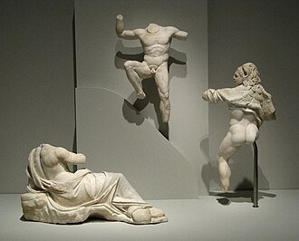 Classical sculpture showing Prometheus forming humans from clay.